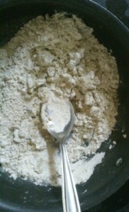 Start kneading with the spoon. You can use your hands and cold water once you add hot water and mix